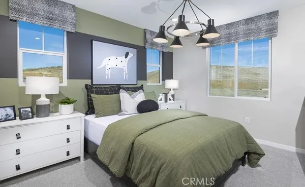 a bed room with a bed and a potted plant