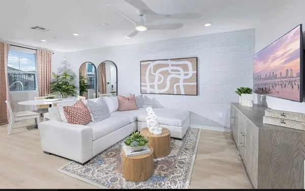 a kitchen with kitchen island a refrigerator a stove a sink and a chairs