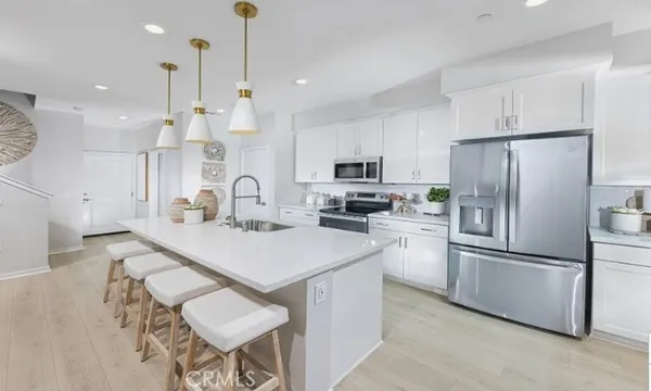 a living room with furniture and painting on the wall