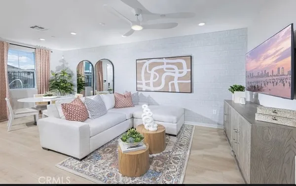 a kitchen with kitchen island a refrigerator a stove a sink and a chairs