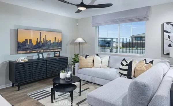 a living room with furniture and painting on the wall