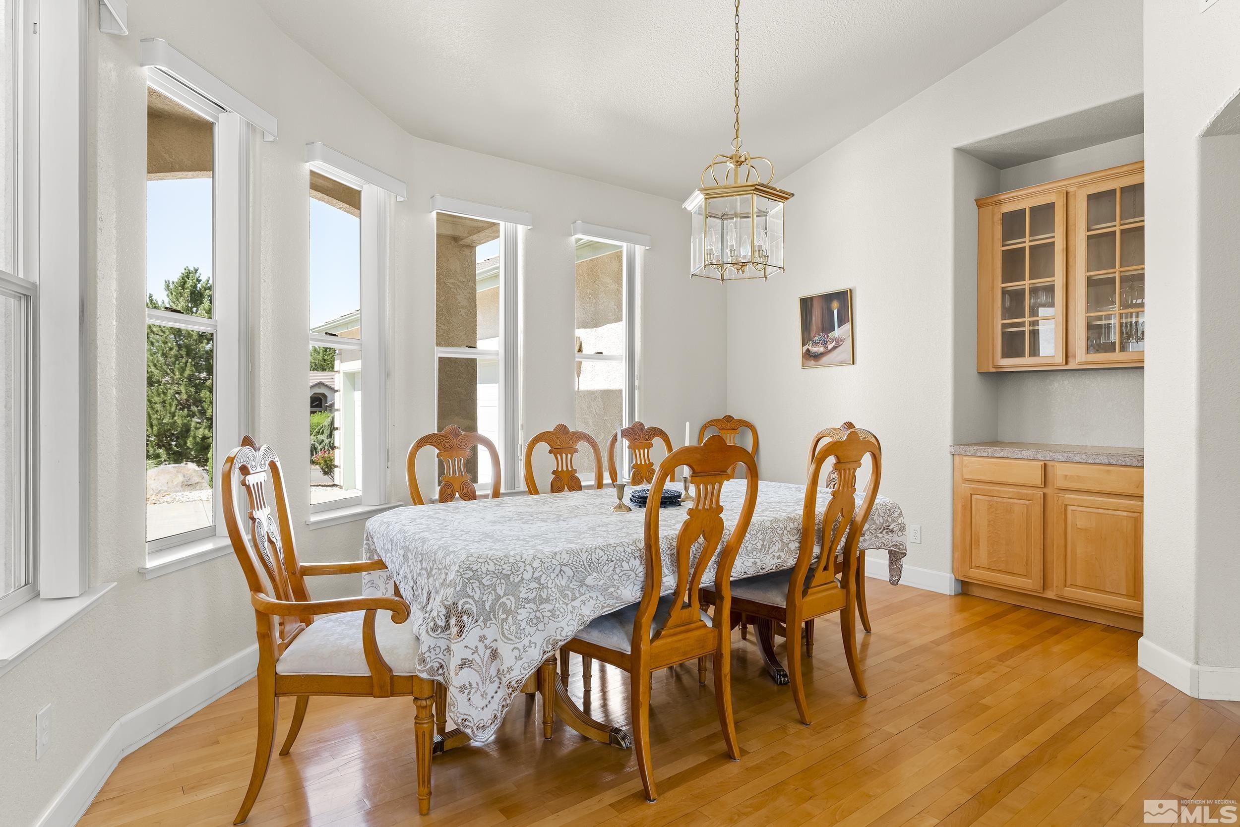 1540 Star Way Reno, NV 89511 - Photo 15 of 37 a view of a a dining room with furniture window and wooden floor