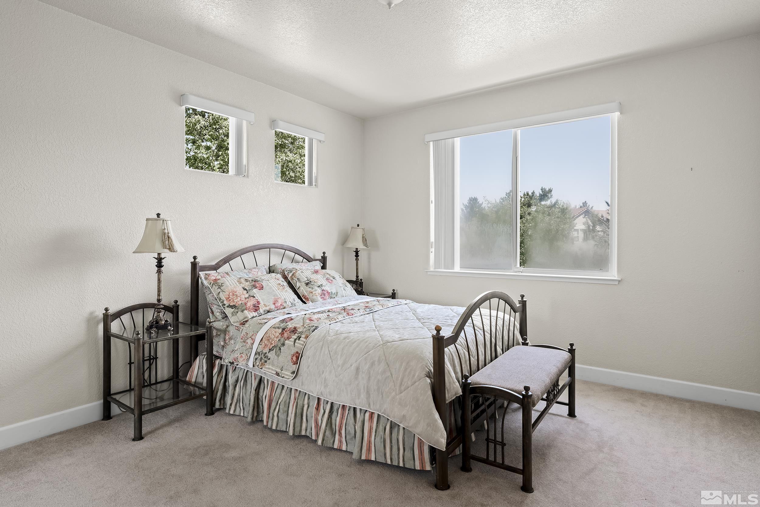 1540 Star Way Reno, NV 89511 - Photo 23 of 37 a bedroom with bed and a window