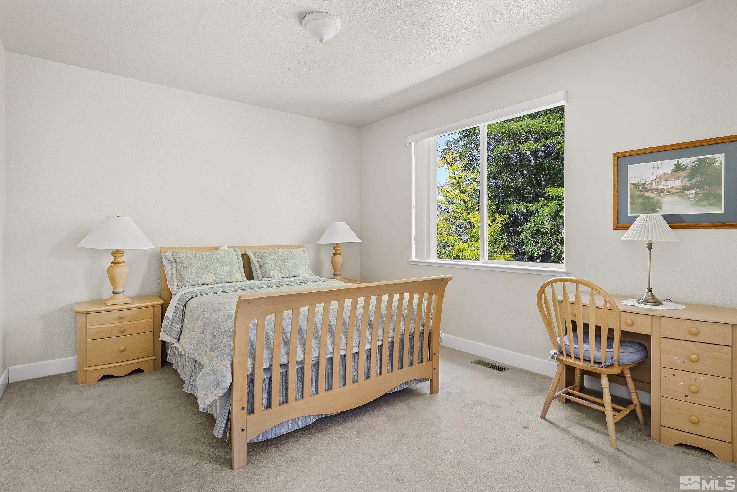 1540 Star Way Reno, NV 89511 - Photo 24 of 37 a bedroom with a bed and a window
