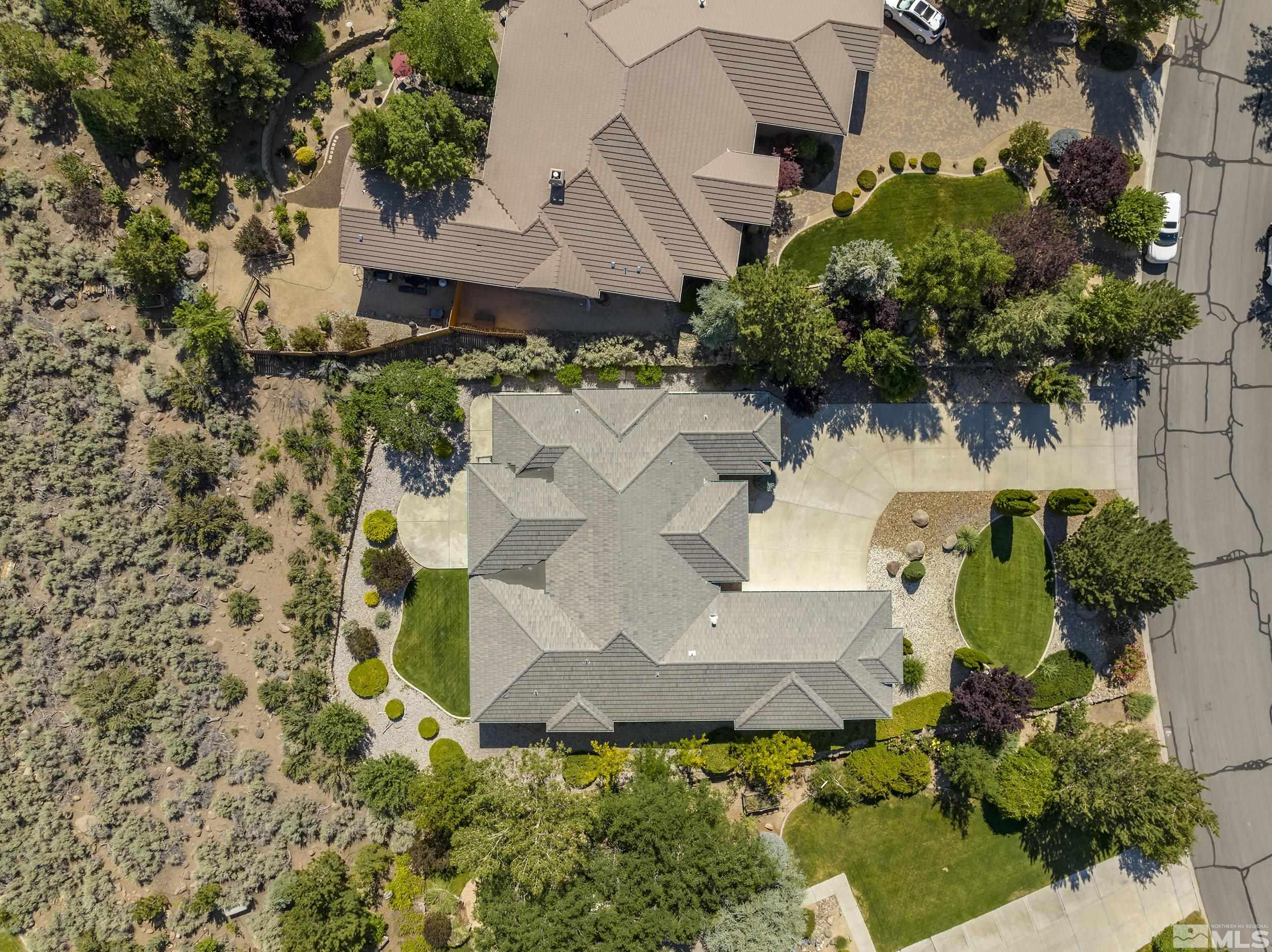 1540 Star Way Reno, NV 89511 - Photo 34 of 37 an aerial view of residential house with outdoor space and trees all around