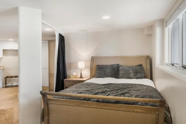 a bed room with a bed and a fireplace