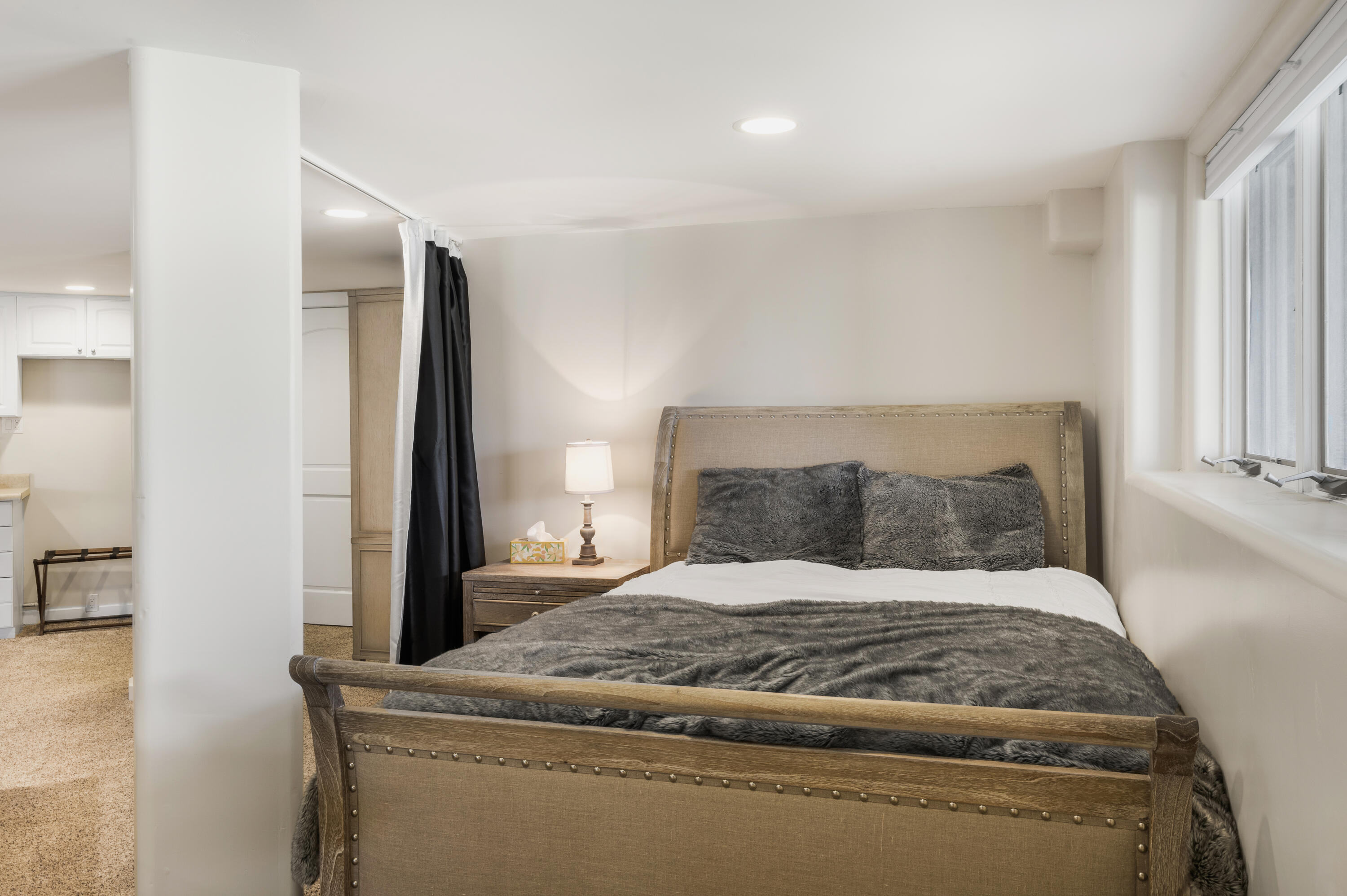 119 Touchdown Drive Mountain Village, CO 81435 - Photo 13 of 31 a bedroom with a large bed and a refrigerator