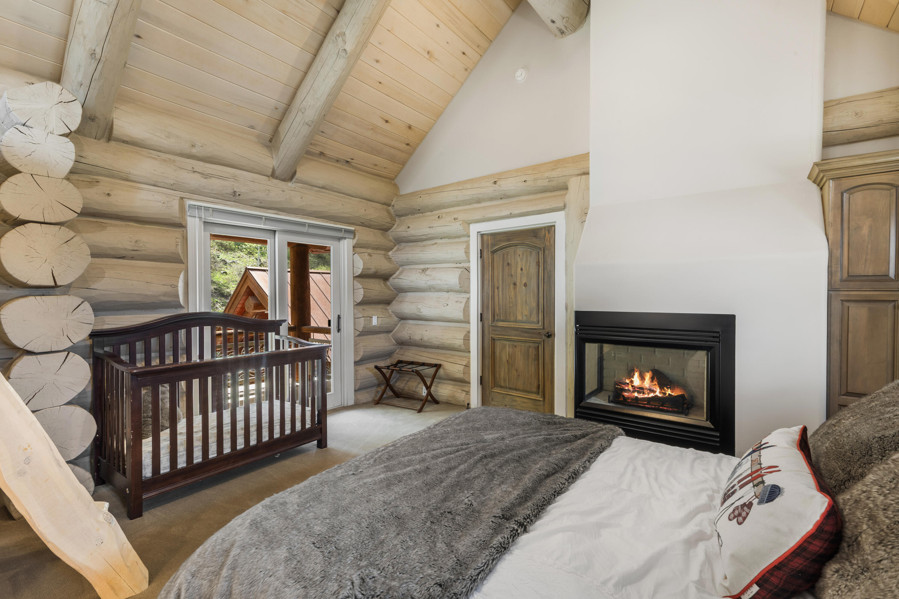 119 Touchdown Drive Mountain Village, CO 81435 - Photo 16 of 31 a bedroom with furniture and a fireplace