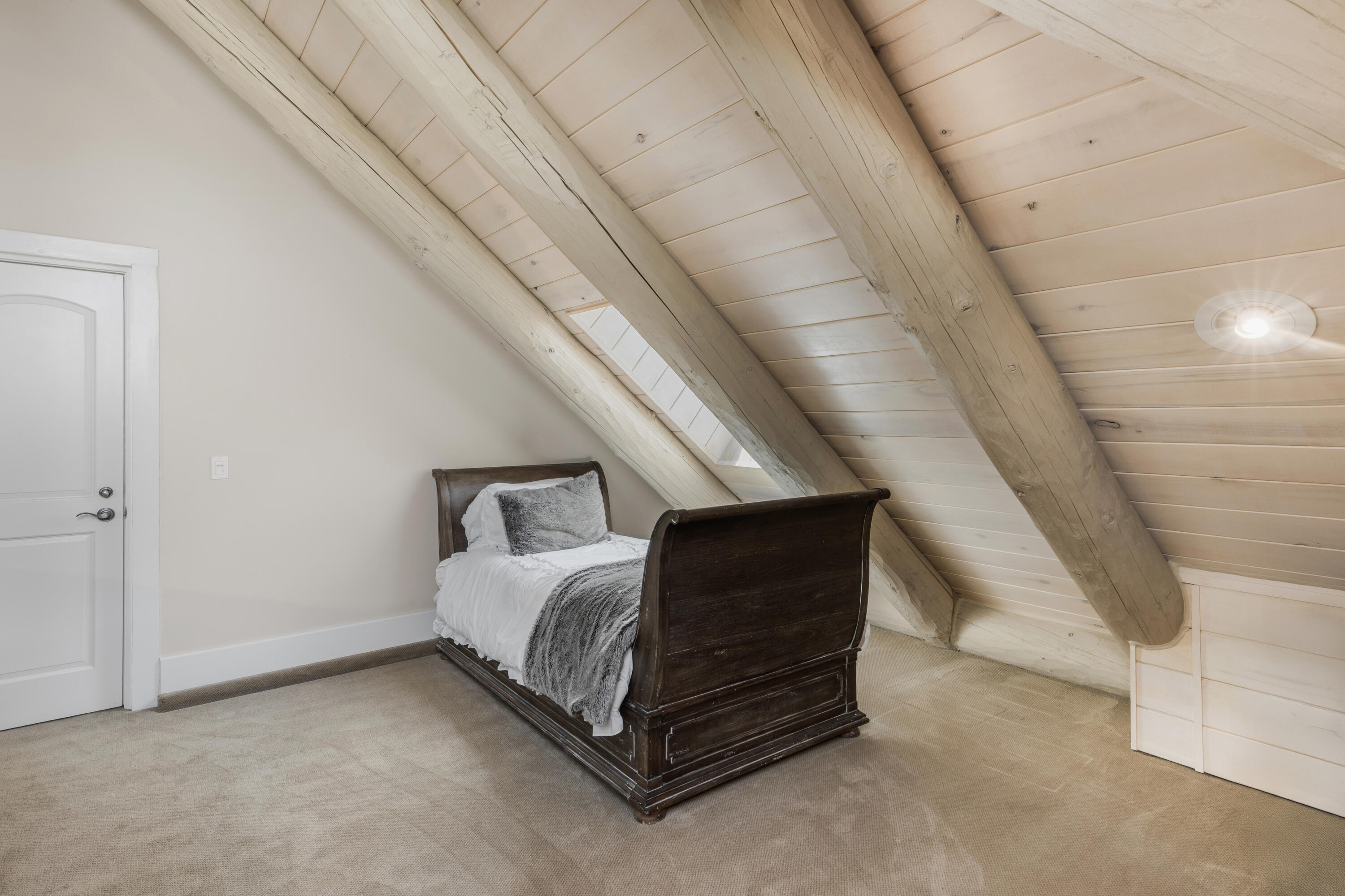 119 Touchdown Drive Mountain Village, CO 81435 - Photo 17 of 31 a spacious bedroom with a bed and a window