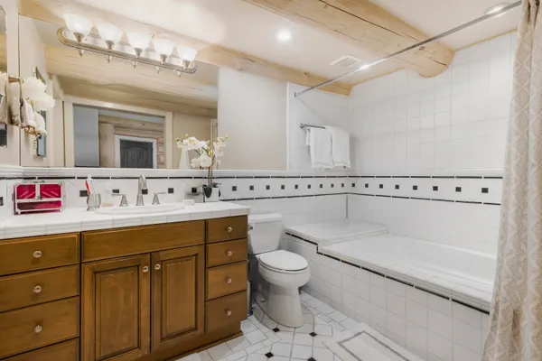 a large kitchen with lots of counter top space and stainless steel appliances