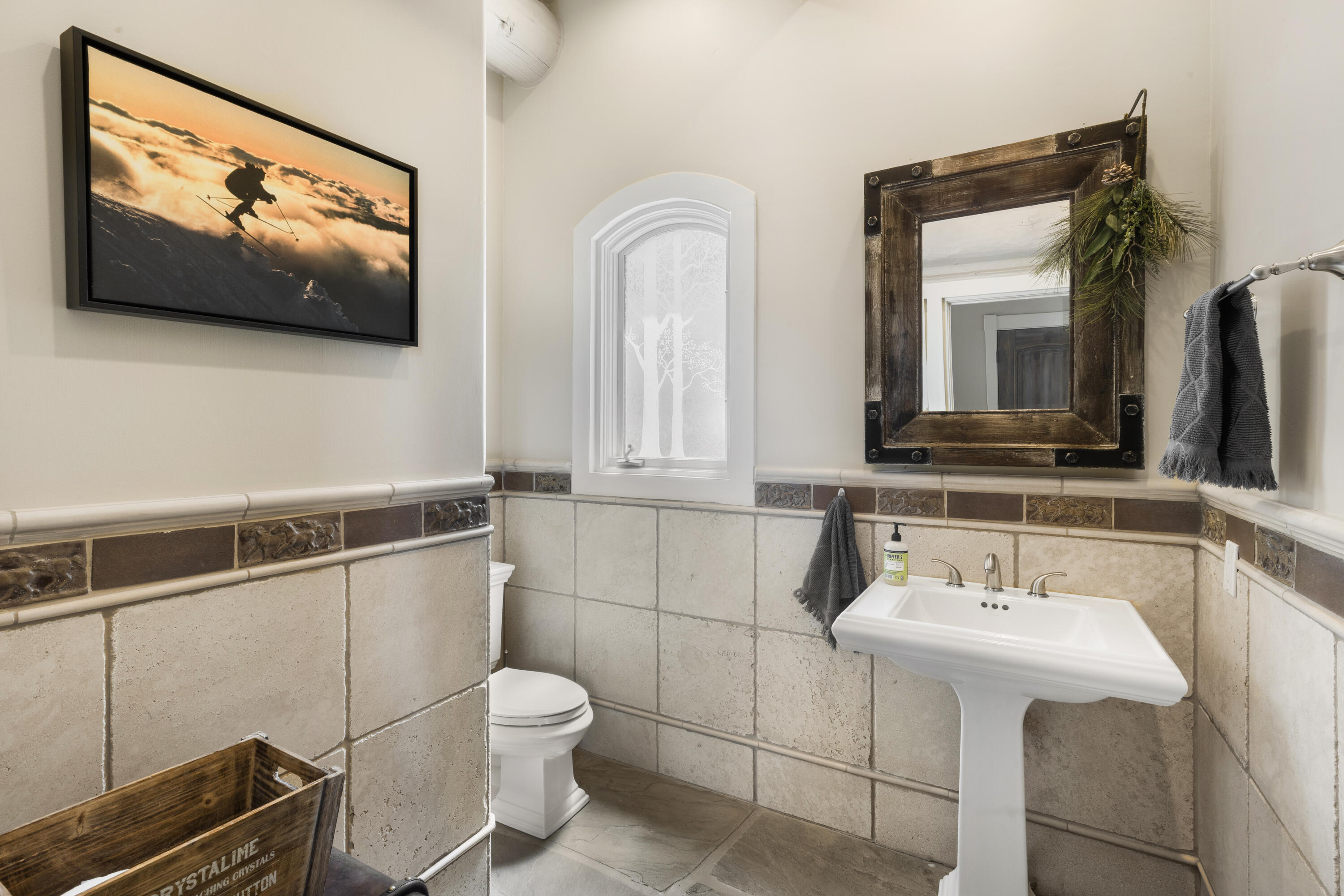 119 Touchdown Drive Mountain Village, CO 81435 - Photo 23 of 31 a bathroom with a toilet a sink and mirror