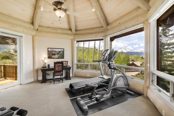 a living room with furniture kitchen view and a table