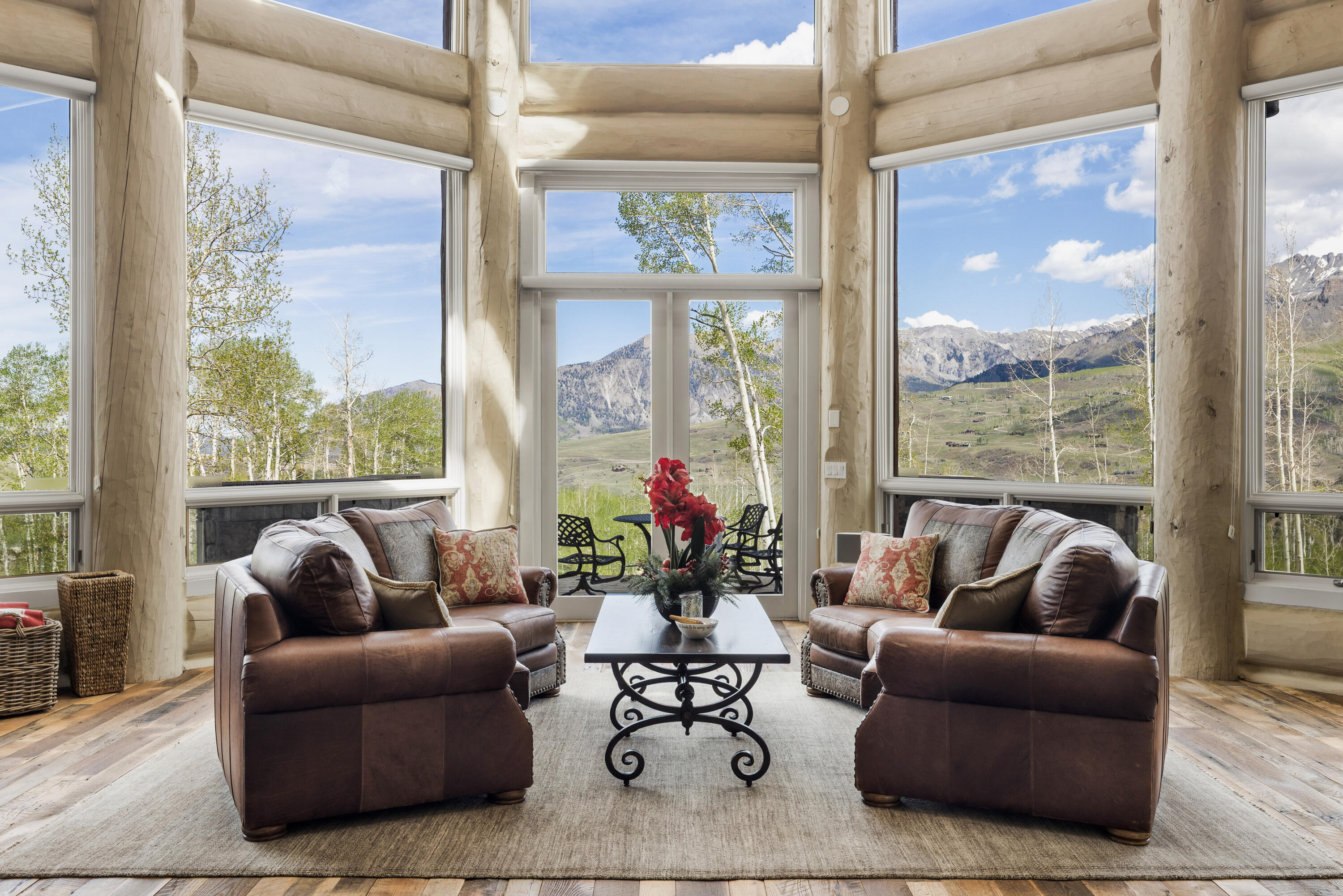 119 Touchdown Drive Mountain Village, CO 81435 - Photo 3 of 31 a living room with furniture and floor to ceiling windows