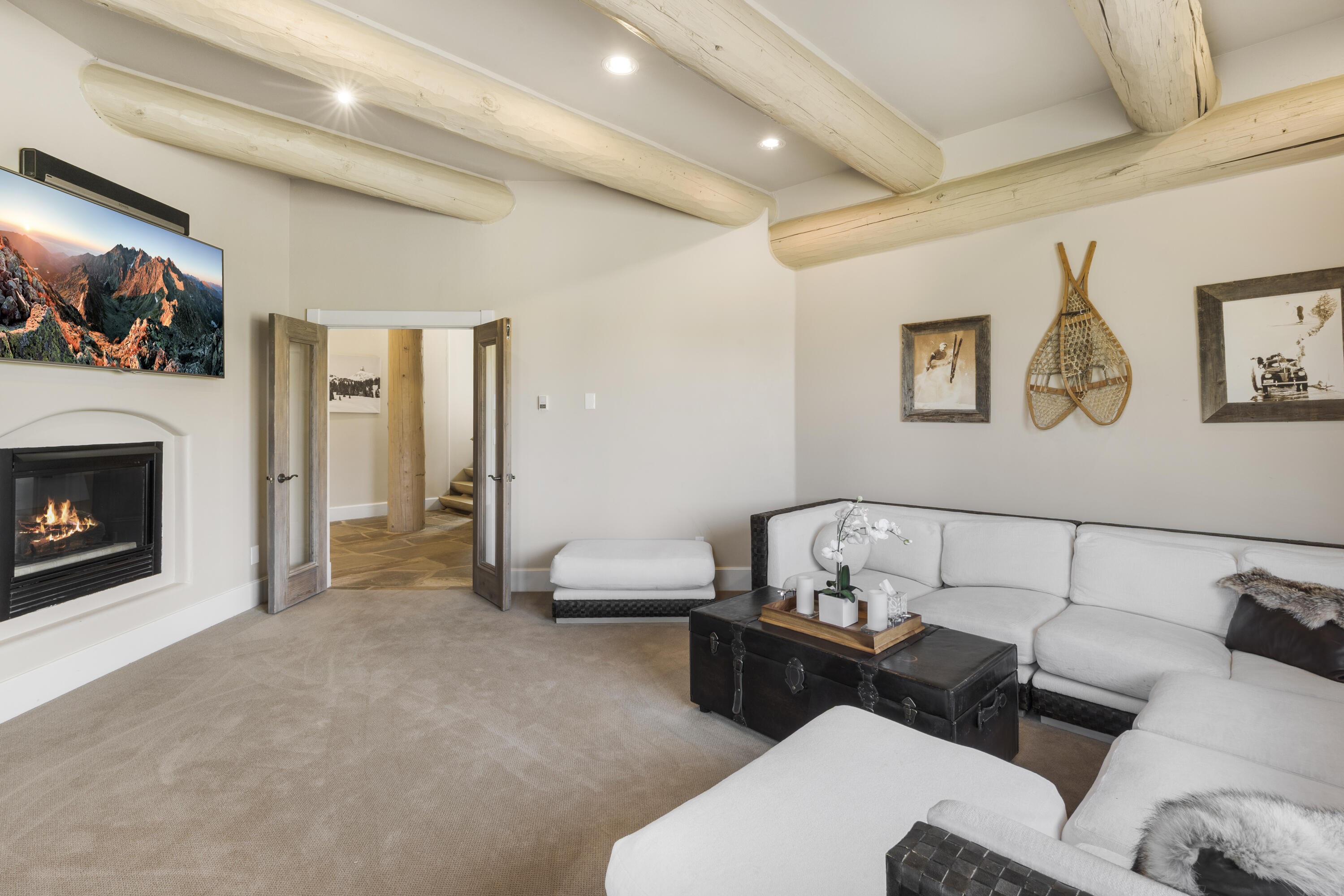 119 Touchdown Drive Mountain Village, CO 81435 - Photo 6 of 31 a bedroom with furniture and a fireplace