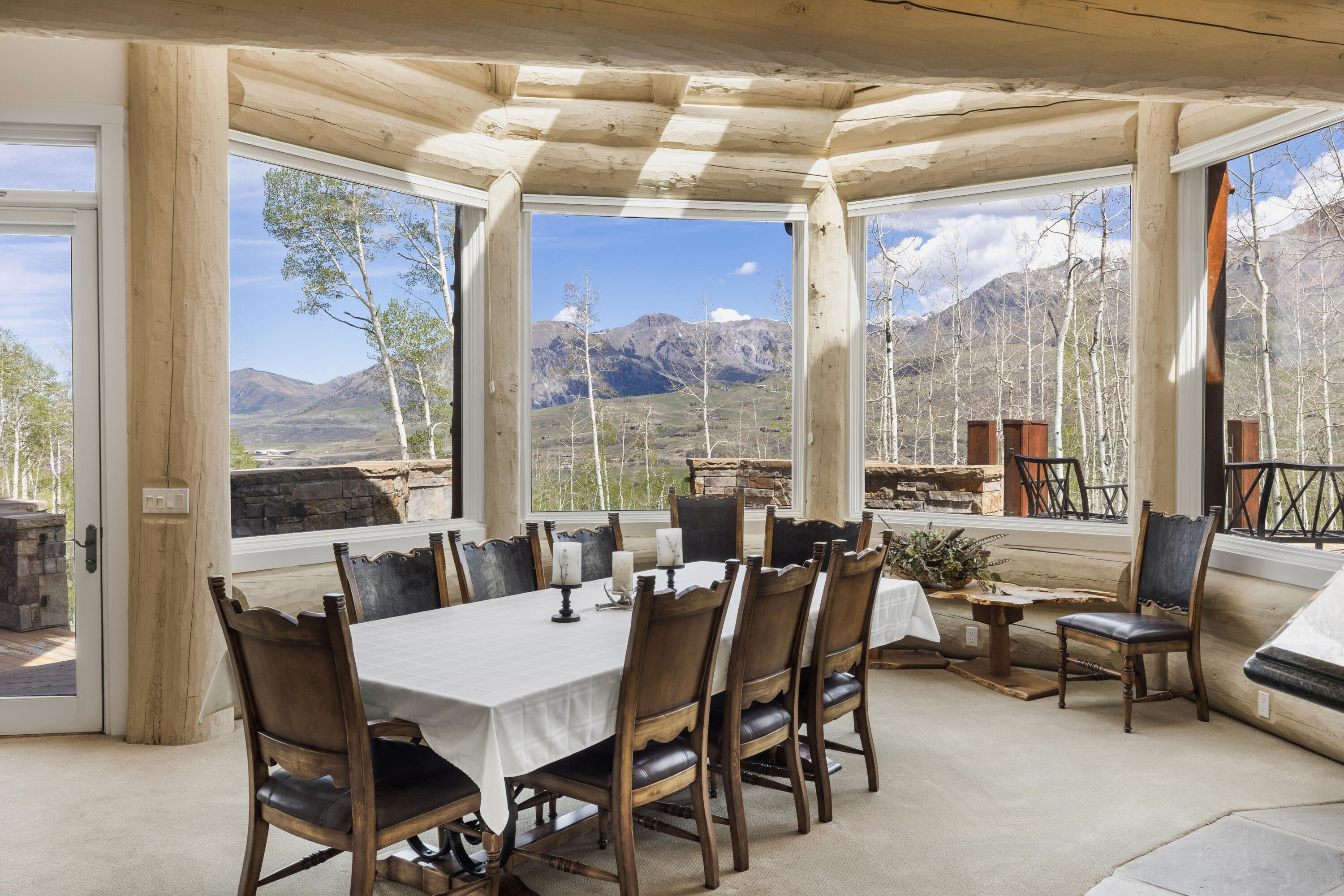119 Touchdown Drive Mountain Village, CO 81435 - Photo 10 of 31 a dining room with furniture and a floor to ceiling window