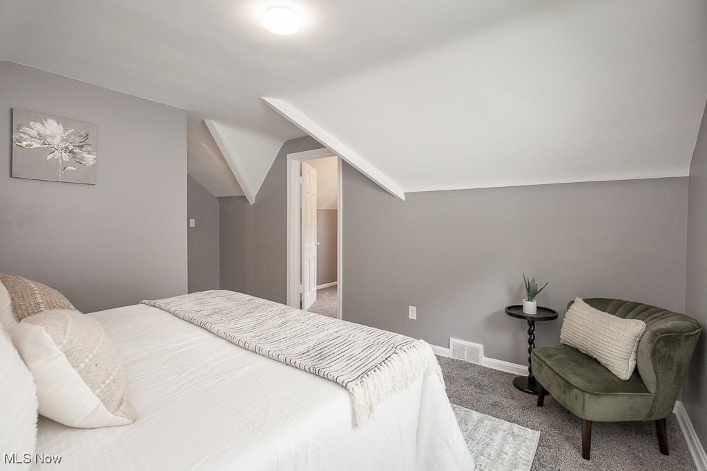 1547 Genesee Road South Euclid, OH 44121 - Photo 21 of 36 Bedroom with carpet, vaulted ceiling, and baseboards