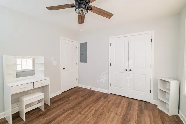 a view of an entryway with wooden floor