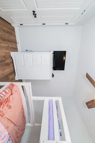 a view of living room with furniture and flat screen tv