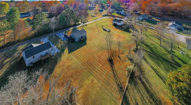 a aerial view of residential houses with outdoor space