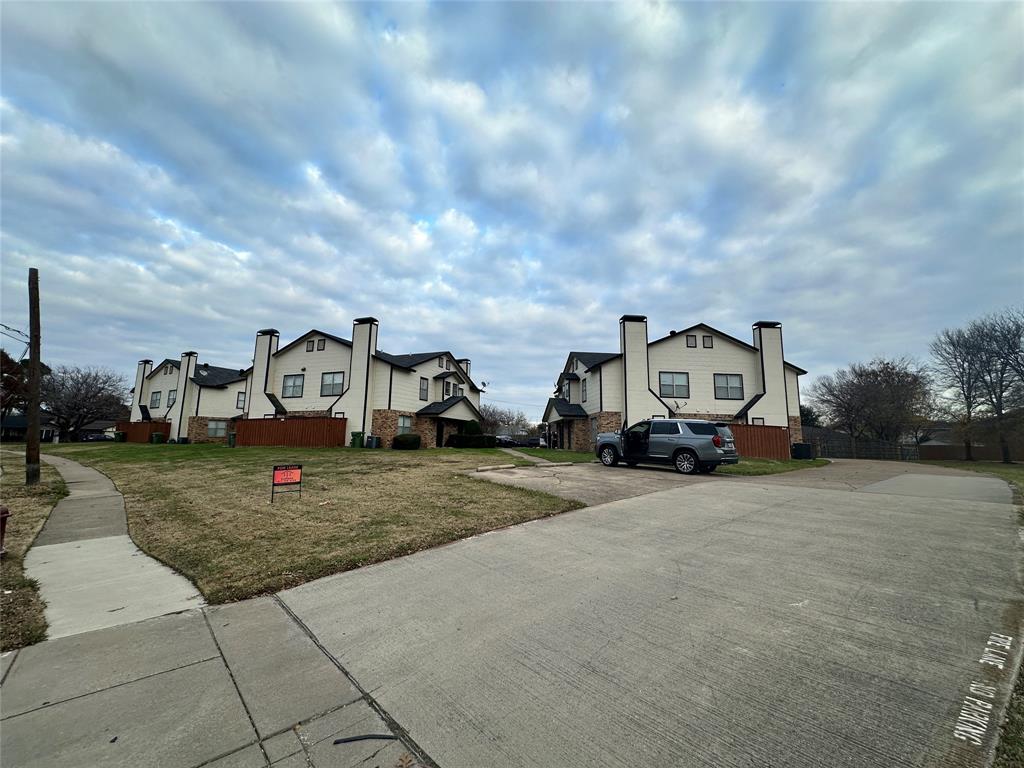 5908 Holiday Lane, Unit C North Richland Hills, TX 76180 - Photo 18 of 18 a view of a house with truck parked