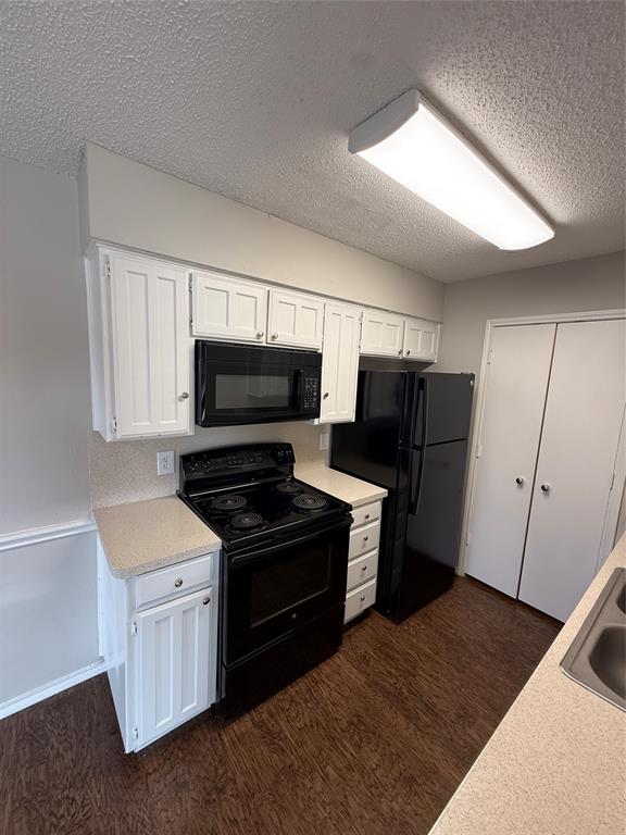 5908 Holiday Lane, Unit C North Richland Hills, TX 76180 - Photo 5 of 18 a kitchen with a refrigerator stove and microwave