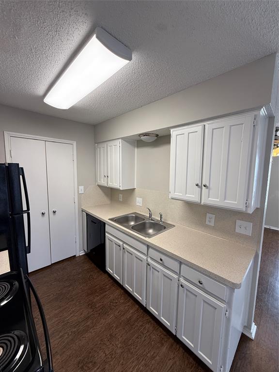 5908 Holiday Lane, Unit C North Richland Hills, TX 76180 - Photo 6 of 18 a kitchen with granite countertop a sink stove and cabinets