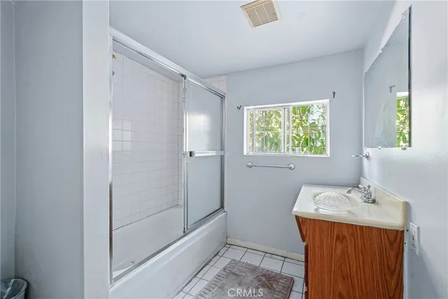 a bathroom with a bathtub toilet and shower