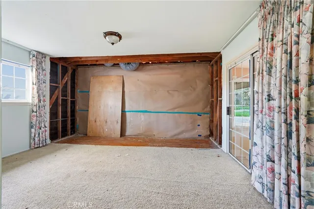 a kitchen with granite countertop a sink and a stove with wooden floor