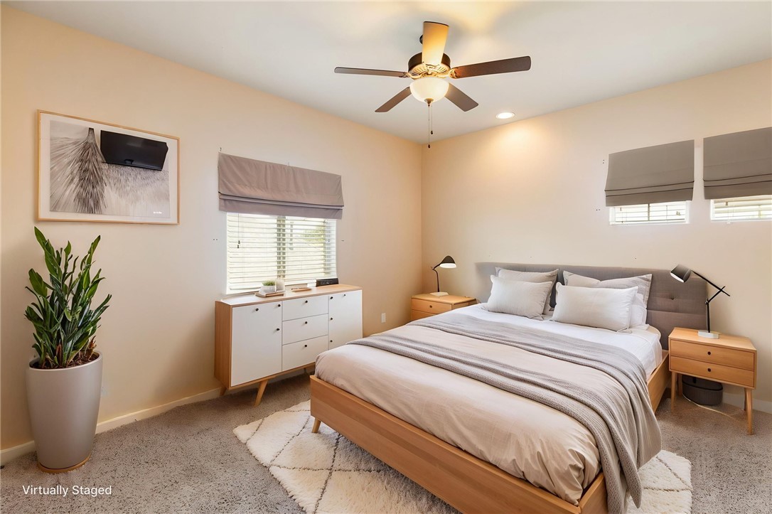 2136 Rockcliffe Loop College Station, TX 77845 - Photo 39 of 48 a bedroom with a large bed and a chandelier