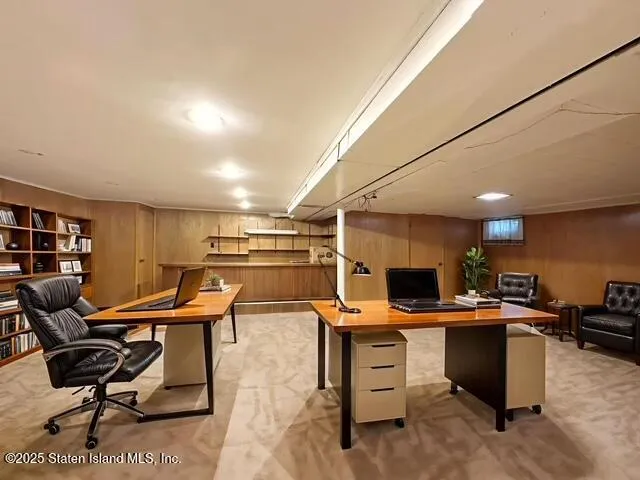 a view of a workspace with furniture