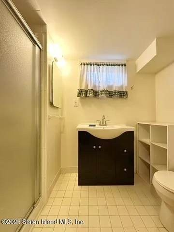 a bathroom with a vanity and a mirror