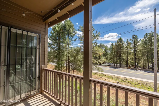 a view of a glass door with a balcony