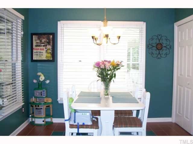 4412 Liverpool Lane Raleigh, NC 27604 - Photo 5 of 12 a dining room with furniture and wooden floor