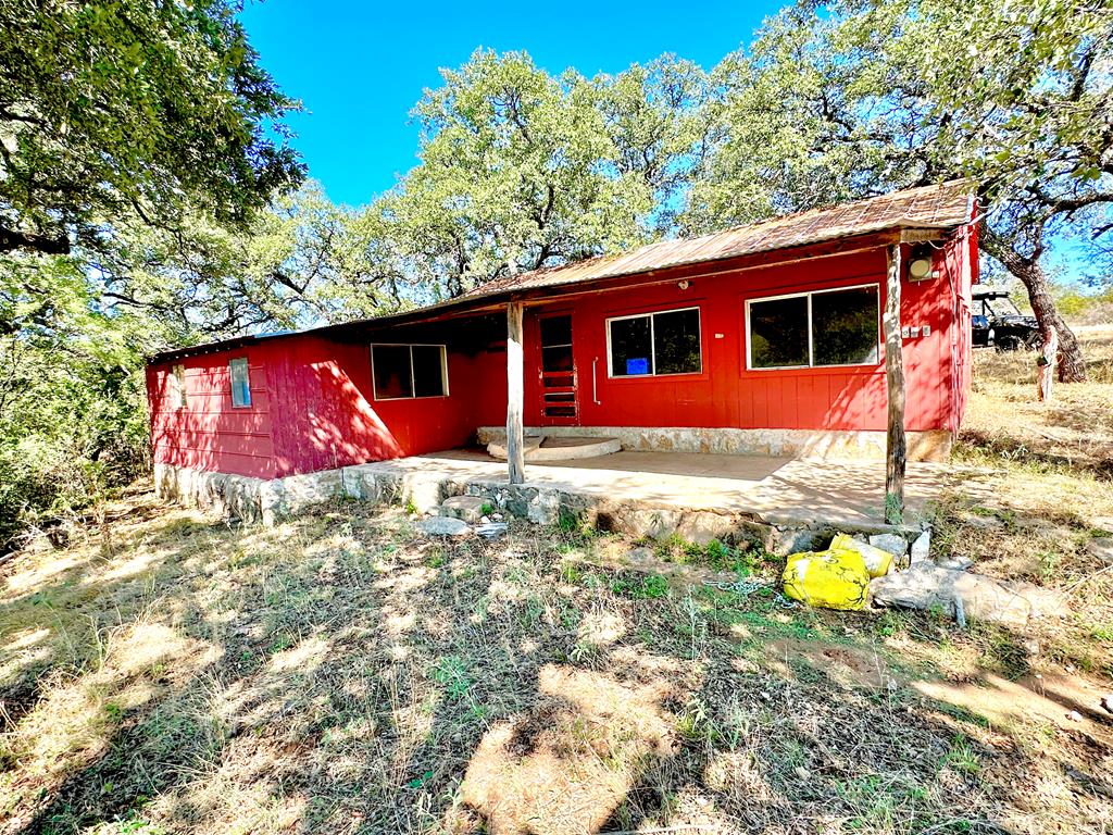 16560 Cedar Bluff Road Mason, TX 76856 - Photo 19 of 34 a backyard of a house with yard and outdoor seating