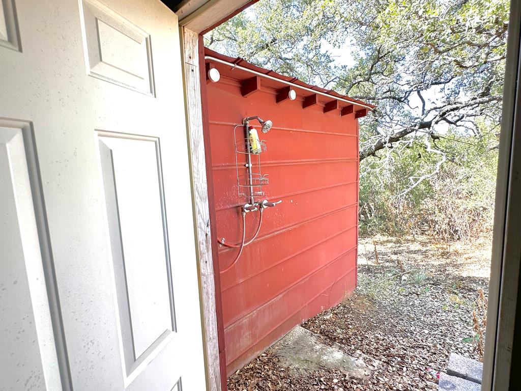 16560 Cedar Bluff Road Mason, TX 76856 - Photo 20 of 34 a front view of a house with a large tree