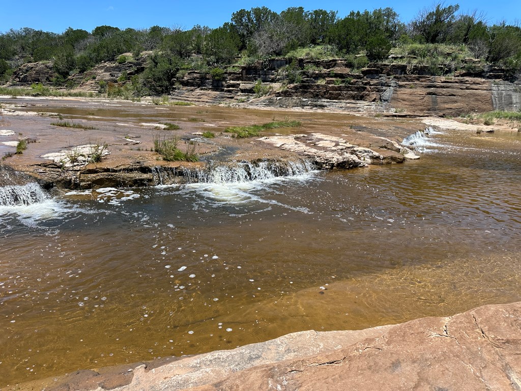 16560 Cedar Bluff Road Mason, TX 76856 - Photo 2 of 34 a view of a lake with beach