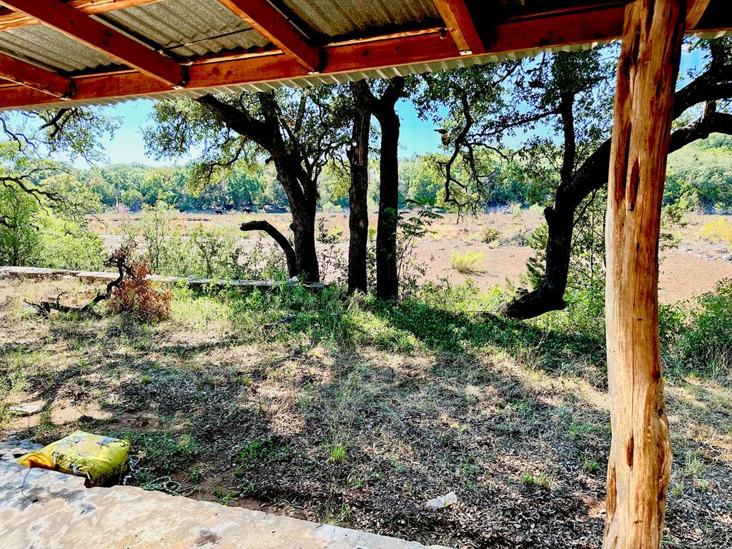 16560 Cedar Bluff Road Mason, TX 76856 - Photo 22 of 34 a backyard of a house with lots of green space