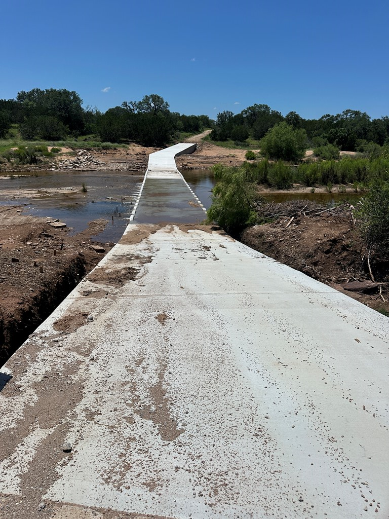 16560 Cedar Bluff Road Mason, TX 76856 - Photo 7 of 34 a view of a dry yard with wooden fence