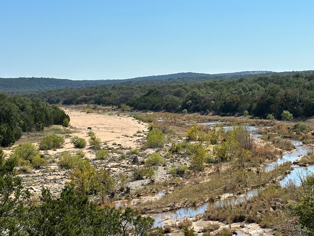 16560 Cedar Bluff Road Mason, TX 76856 - Photo 8 of 34 a view of a lake with mountains in the background