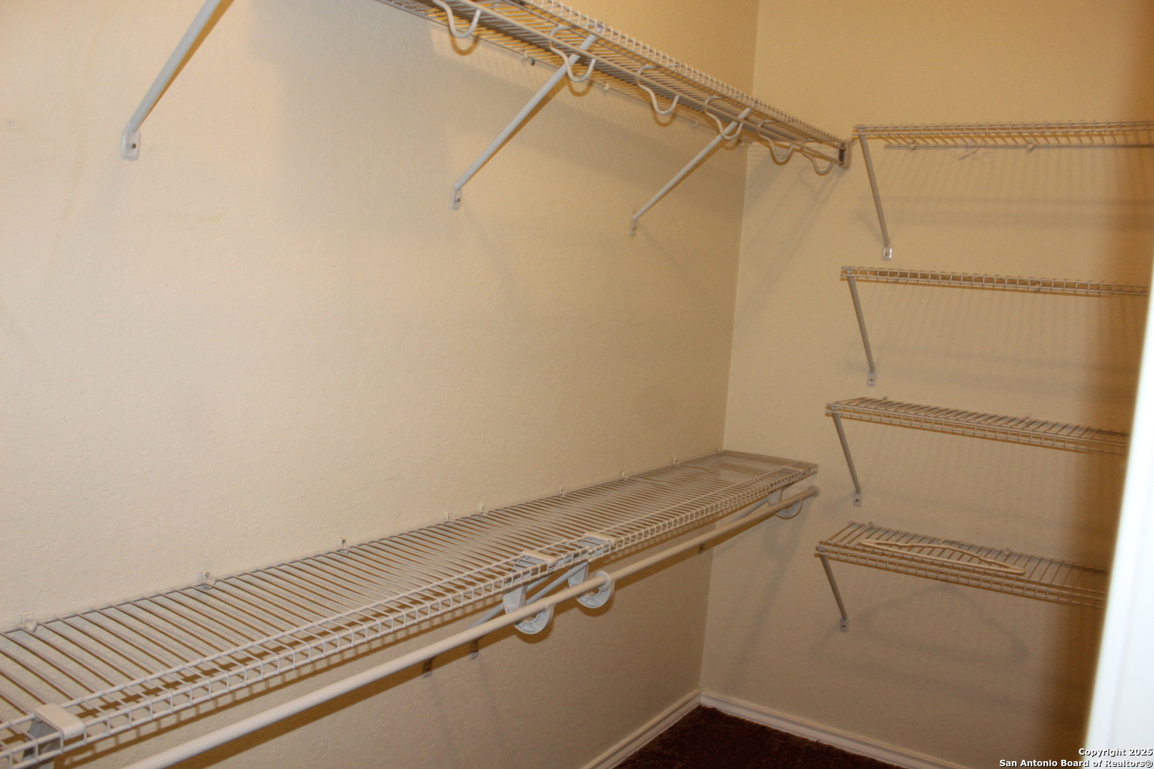 482 Walnut Crest Selma, TX 78154 - Photo 16 of 19 a view of a room with racks on the wall