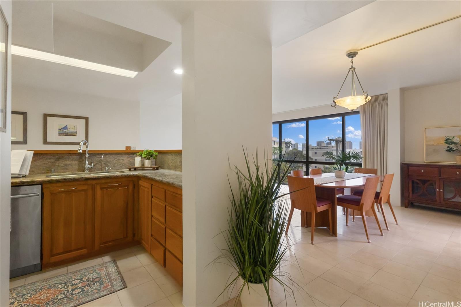 217 Prospect Street, Unit D11 Honolulu, HI 96813 - Photo 13 of 24 a dining room filled a chandelier and kitchen view