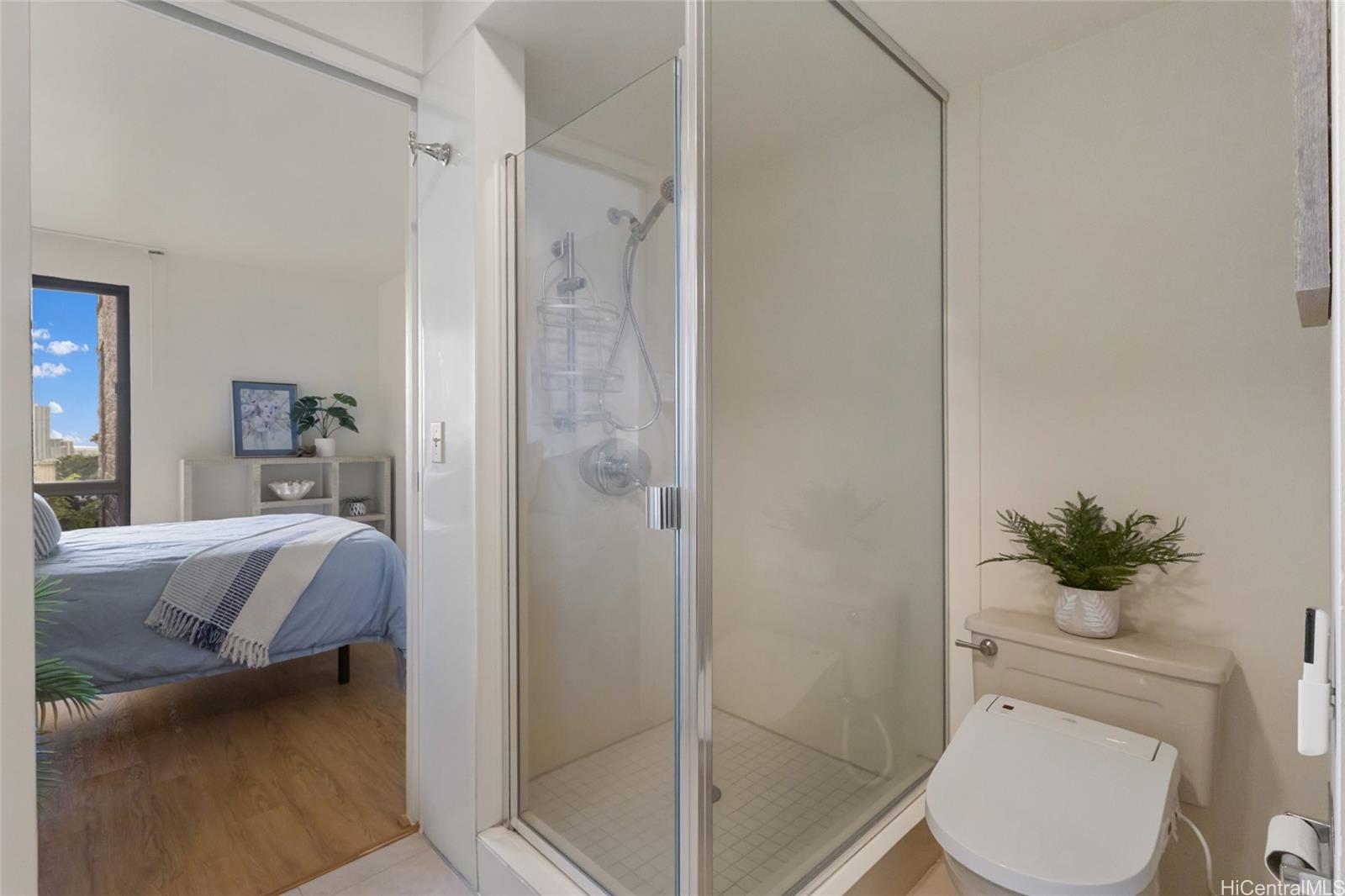 217 Prospect Street, Unit D11 Honolulu, HI 96813 - Photo 14 of 24 a bathroom with a granite countertop sink a toilet and shower