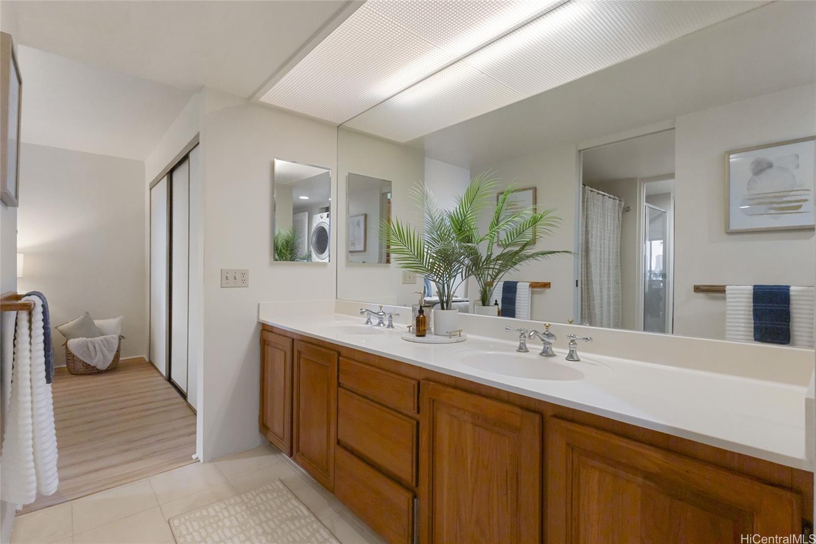 217 Prospect Street, Unit D11 Honolulu, HI 96813 - Photo 16 of 24 a spacious bathroom with a double vanity sink and a mirror