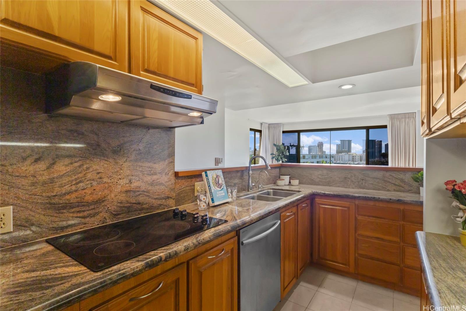 217 Prospect Street, Unit D11 Honolulu, HI 96813 - Photo 20 of 25 a kitchen with a sink and cabinets