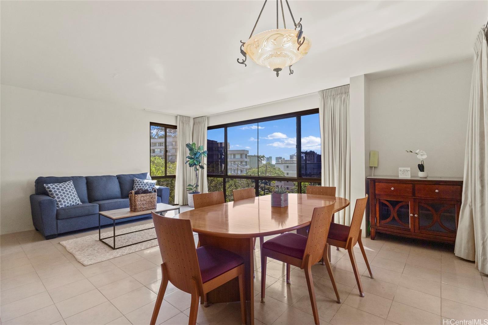217 Prospect Street, Unit D11 Honolulu, HI 96813 - Photo 2 of 25 a dining room with furniture a chandelier and window