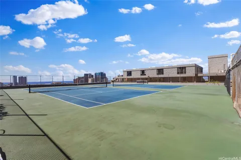 a view of an outdoor space and tennis court