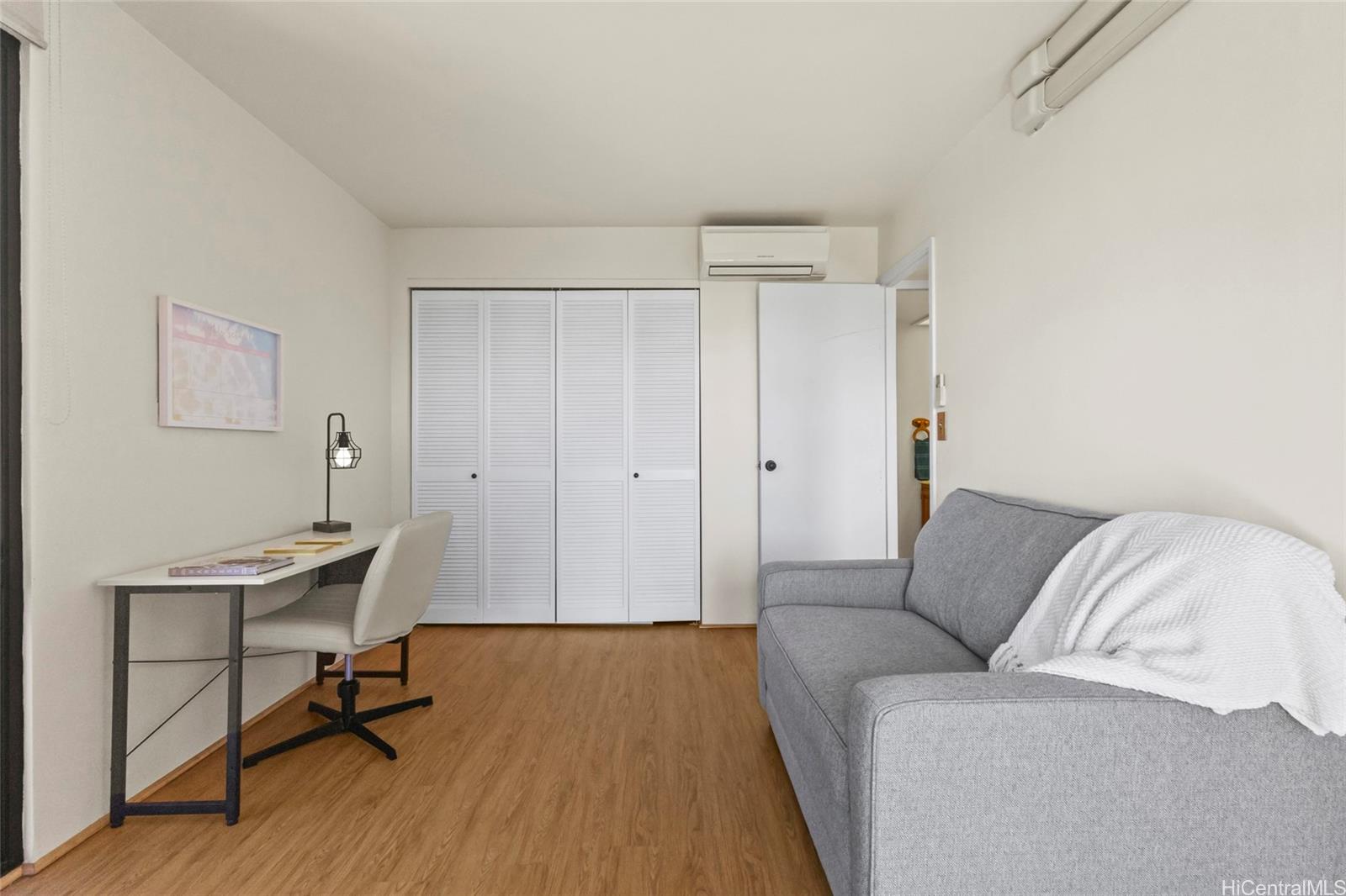 217 Prospect Street, Unit D11 Honolulu, HI 96813 - Photo 8 of 25 a view of a livingroom with furniture and wooden floor