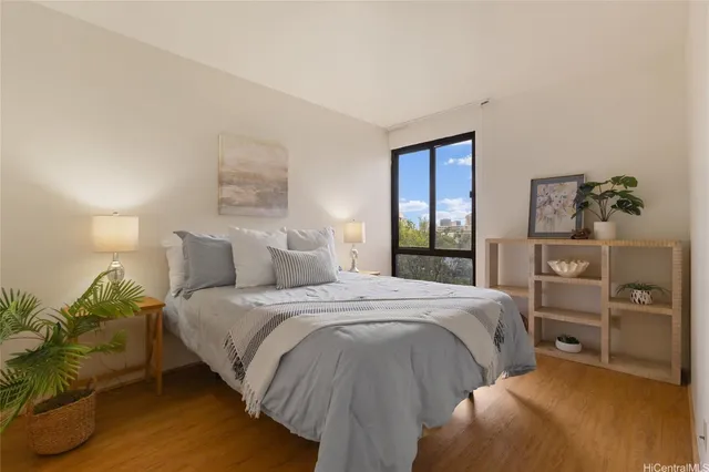 a bedroom with a bed and a dresser