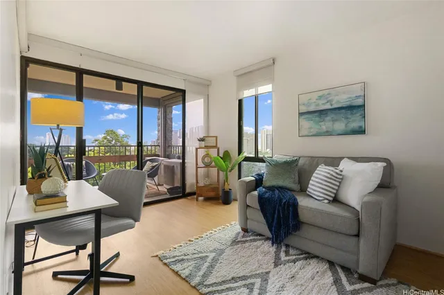 a living room with furniture and a large window