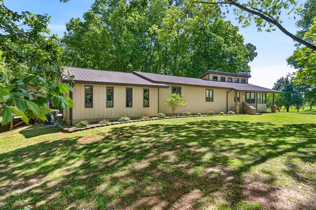 143 Griffintown Road Sparta, TN 38583 - Photo 4 of 35 a view of an house with backyard space and garden